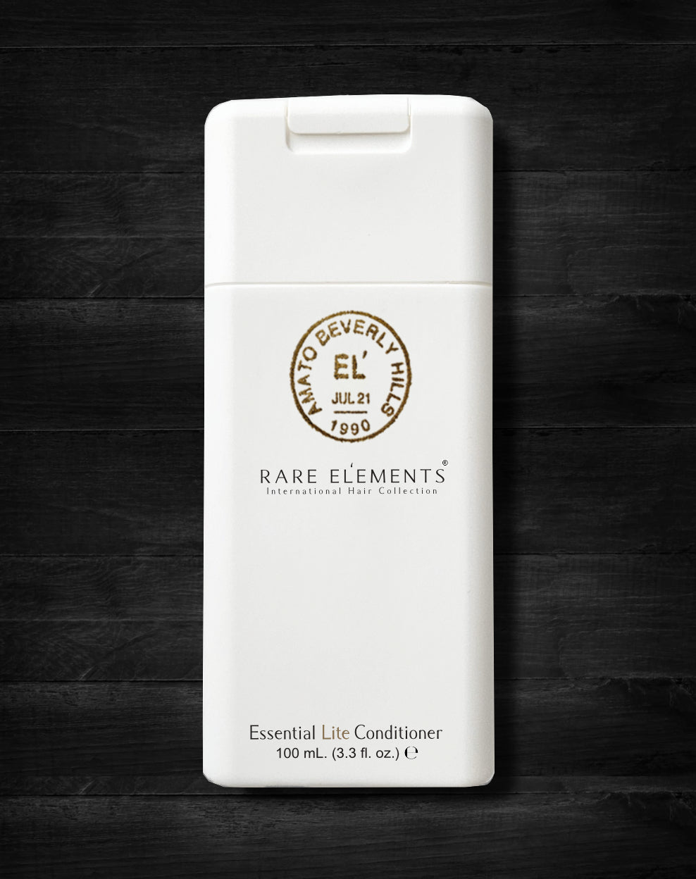 Travel-size conditioner bottle with a white label, displaying the brand Rare Elements and the product name Essential Lite Conditioner.