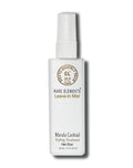 A white glass bottle with a spray mist  labeled 'Rare Elements Marula Cocktail Leave-In Styling Treatment'.